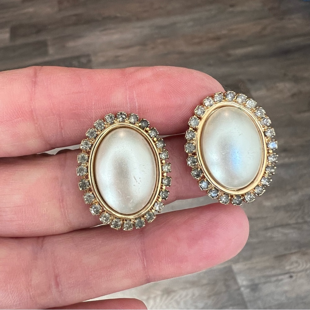 Vintage statement clip-on earrings featuring oversized oval faux pearl cabochon